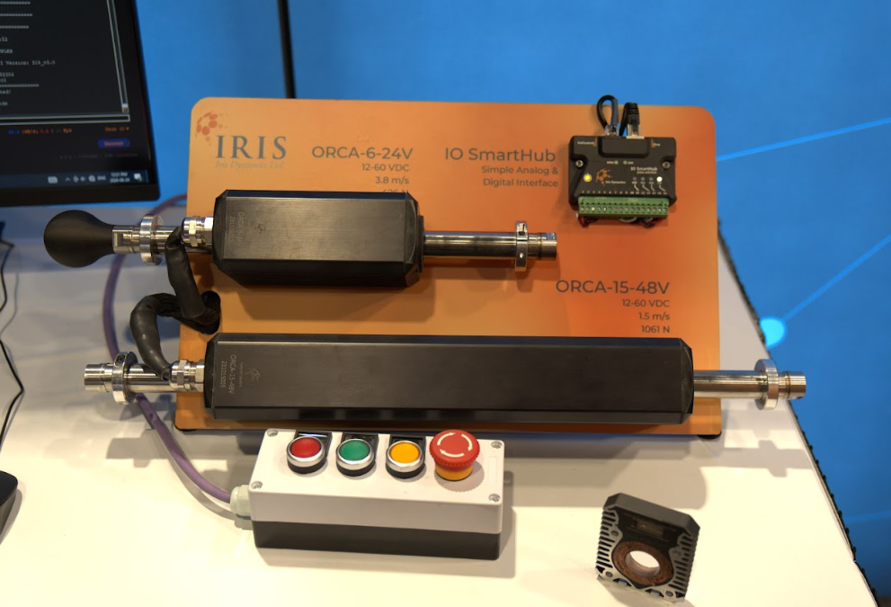 ORCA™ Smart Linear Motor demonstration showcasing horizontally mounted ORCA motors, an IO SmartHub module, and a control button panel