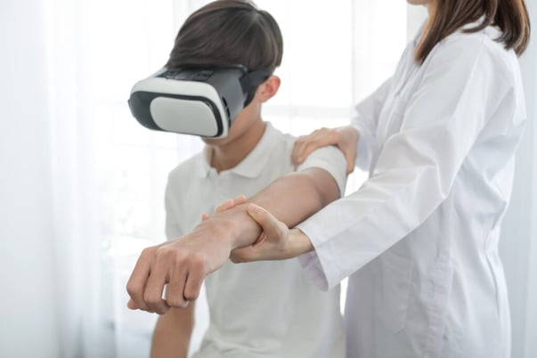 boy-wearing-vr-headset-physical-therapy-force-feedback
