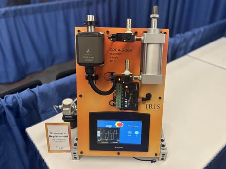 Pneumatic replacement demo unit showing an ORCA™ Smart Linear Motor side-by-side with a traditional pneumatic cylinder for performance comparison
