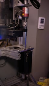A linear motor test platform including a load cell.